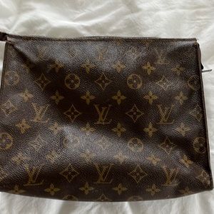 Vintage Louis Vuitton cosmetic bag. Bag code is 822.
